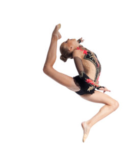 Young teenager girl doing gymnastics exercise with hoop isolated